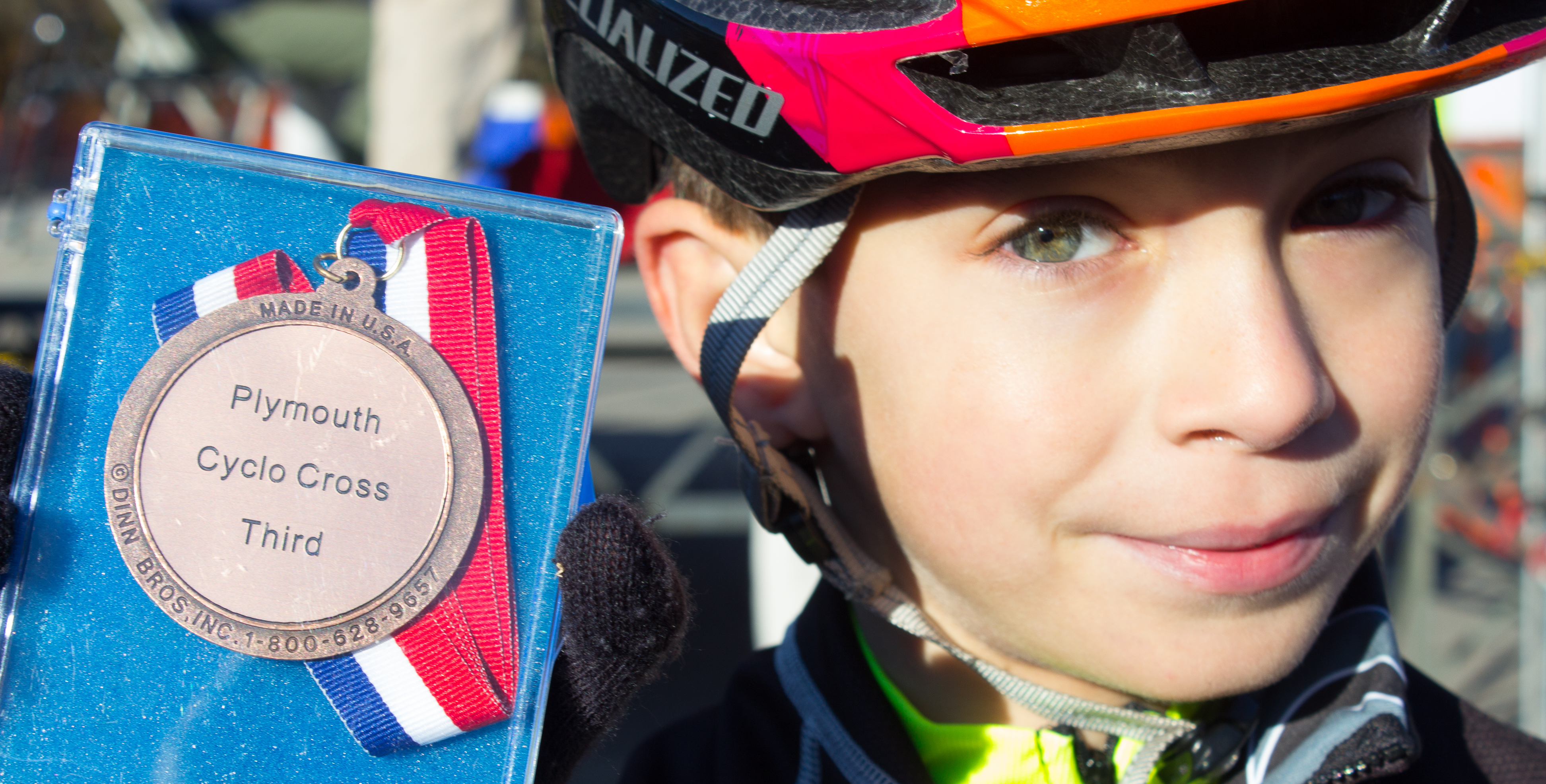 boy with finishing medal after race